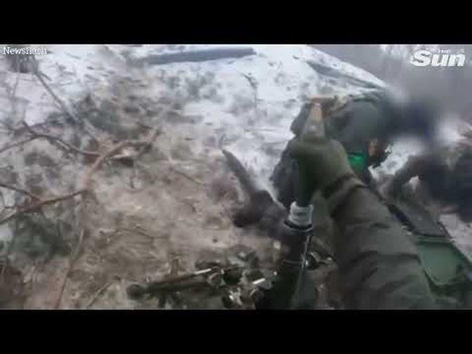 Ukrainian soldiers fire at Russian troops in face-to-face combat on frozen battlefield