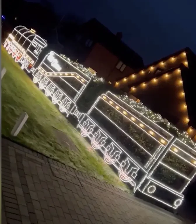 Father and son turn front hedge into incredible 'Polar Express' themed light display