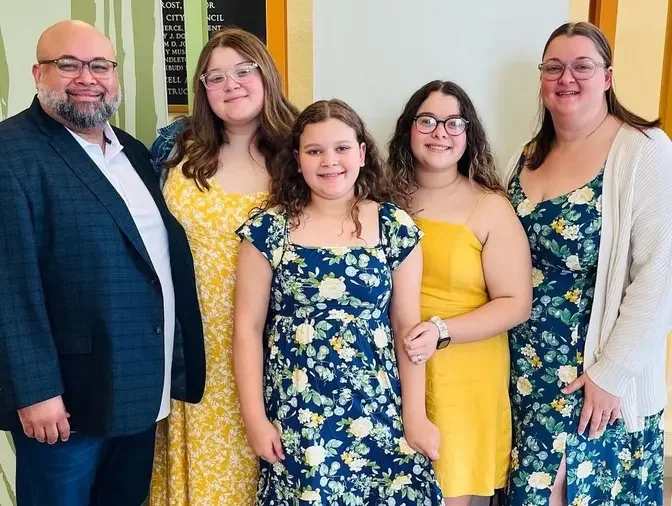 Mr. Holland with his wife and three daughters. (Courtesy of Steventhen Holland)