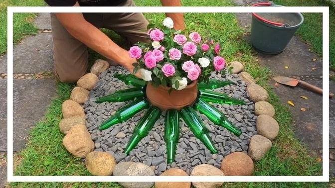 Flower bed with mini roses and glass bottles / Garden ideas