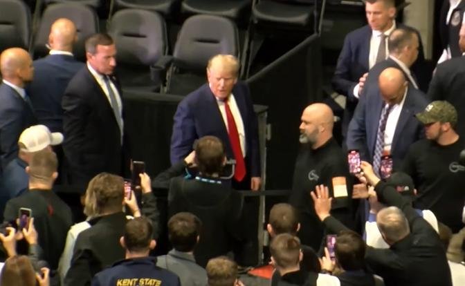Trump attends wrestling tournament after predicting arrest on social media